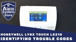 How To Clear Trouble Conditions On Honeywell Lynx L5210  AlarmSystemStore [upl. by Ahsikel191]