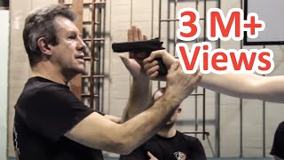 KRAV MAGA TRAINING • The Fastest gun disarm Tutorial [upl. by Ahsinert]