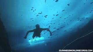 Farthest swim under ice Guinness World Records [upl. by Lerad]